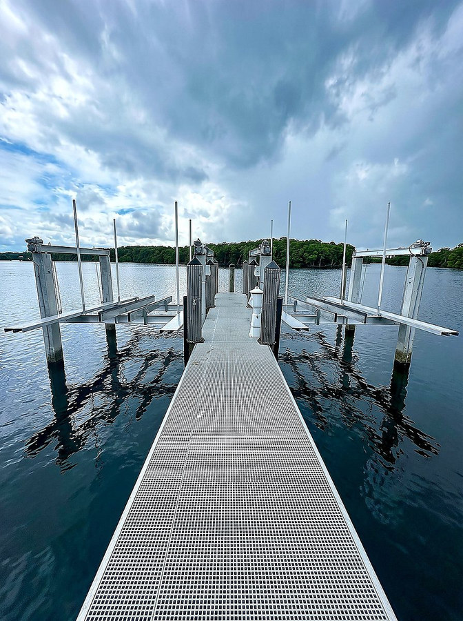 Boat lift walkway over calm South Florida waterway