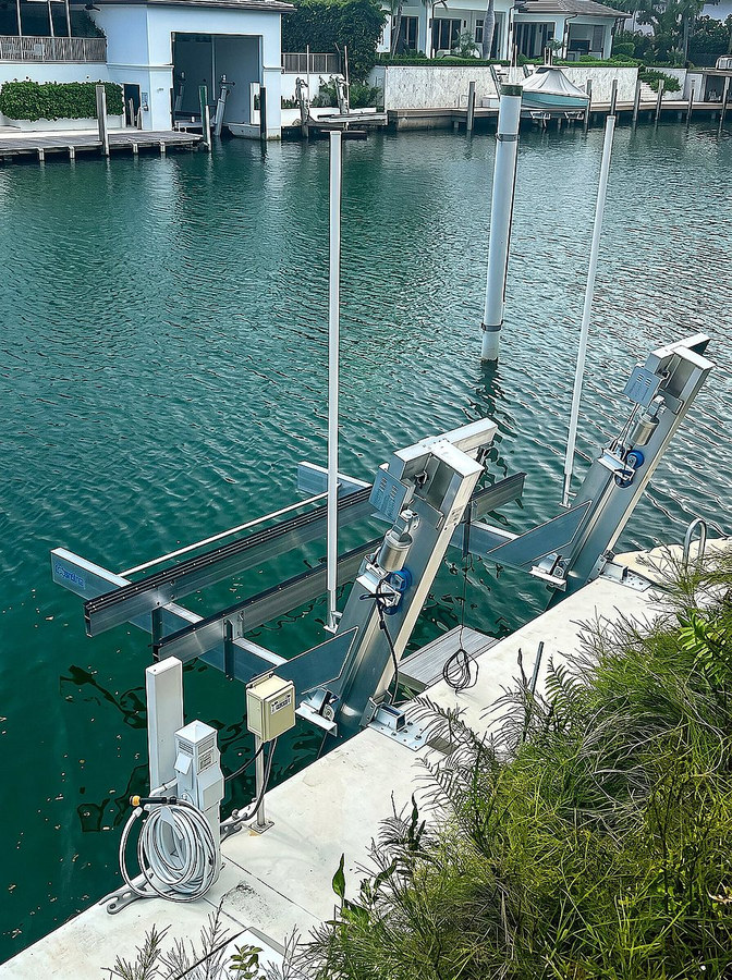 Boat lift rails and motor detail — South Florida waterfront