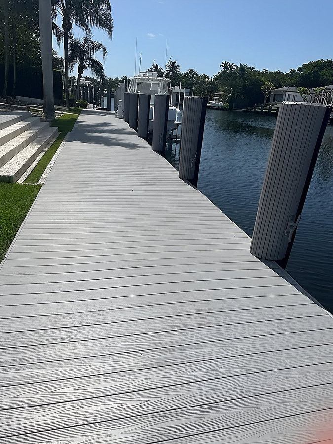 Composite dock walkway with palm trees and moored boats — South Florida