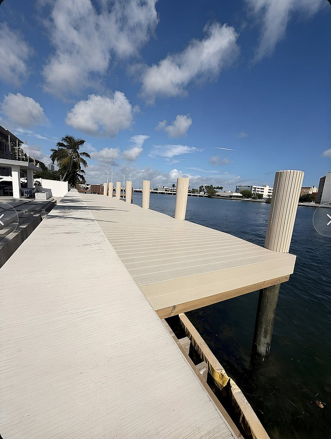 Dock extension with composite decking — bright daylight — South Florida
