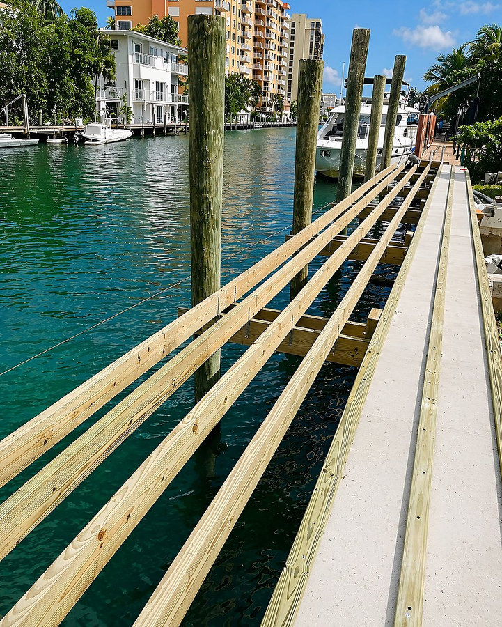 Dock framing and structural pilings under construction — South Florida