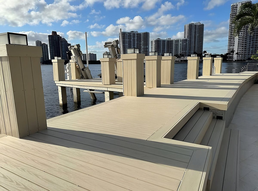 Luxury dock with dual boat lifts and covered slips — South Florida