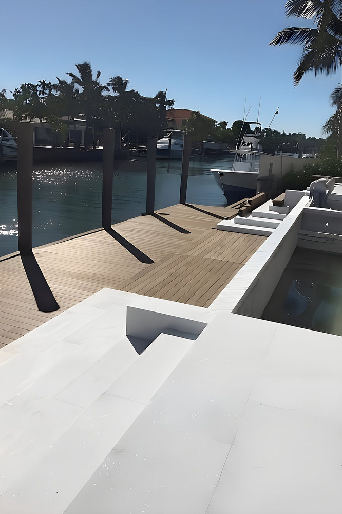 Ipe wood dock with seawall steps and boat lift posts on South Florida waterway — Contour Marine