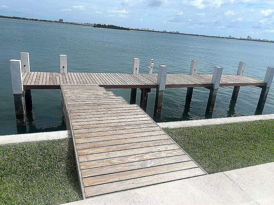 White square composite pilings supporting a Biscayne Bay dock — Contour Marine South Florida