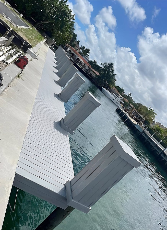 Square composite piling wraps on South Florida dock — Contour Marine